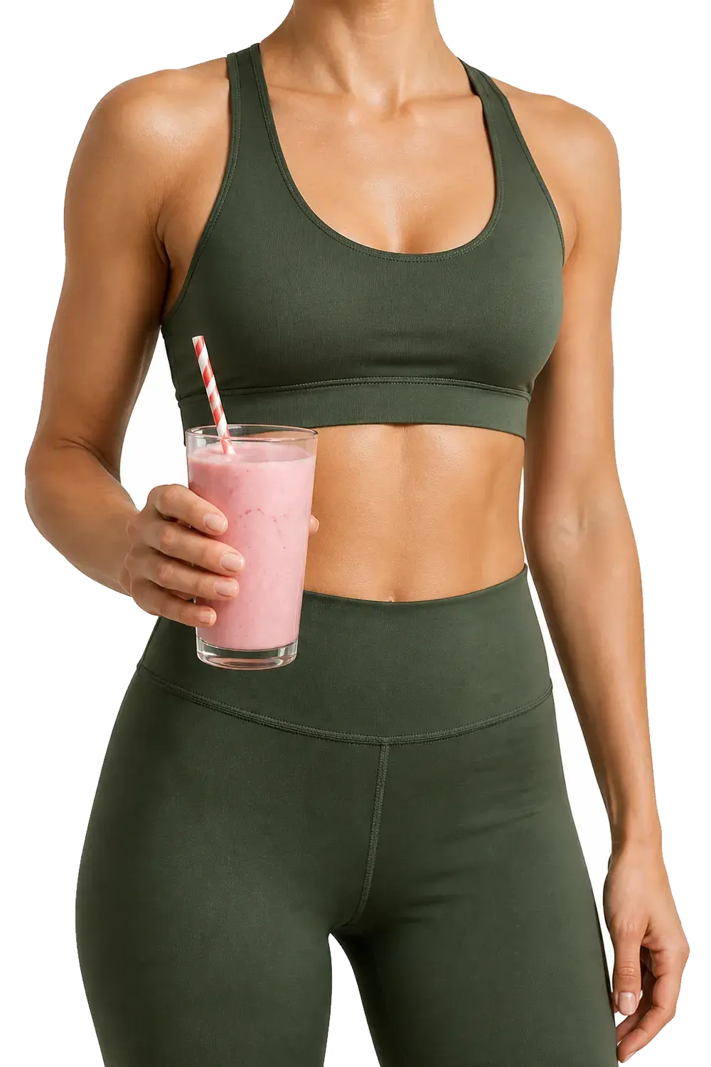 Woman in sportswear holding a glass of strawberry protein shake